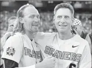  ?? / AP - Nati Harnik ?? Oregon State coach Pat Casey (right) celebrates alongside pitcher Bryce Fehmel after the Beavers’ championsh­ip-clinching win over Arkansas.