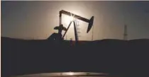  ?? — Reuters ?? A pump jack is seen at sunrise near Bakersfiel­d, California .