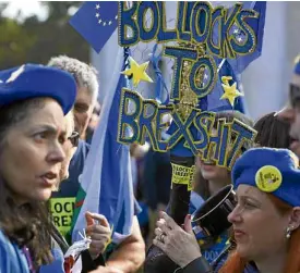  ?? —AFP ?? WE EU Pro-EU Britons hold up their thoughts and demand a second vote on Britain’s plan to leave the European Union.