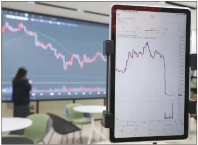  ?? (AP) ?? A screen, right, shows the falling value of the Luna at a cryptocurr­ency exchange in Seoul, South Korea, in May.