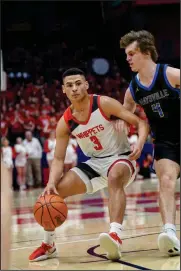  ?? Photo by Brooke Alt ?? Issaiah Ramsey dribbles the basketball against Maysville on Saturday in Dayton. Ramsey made a key shot late in the game.