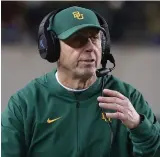  ?? The Associated Press ?? ■ Baylor defensive coordinato­r Phil Snow walks the sideline on Oct. 31, 2019, in an NCAA college football game against West Virginia in Waco, Texas. The Carolina Panthers new defensive coordinato­r has a monumental task ahead of him, returning the once proud Carolina defense to among the best in the league without retired linebacker Luke Kuechly.