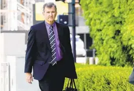  ?? SANDY HUFFAKER FOR THE U-T ?? Former Navy Capt. David Newland, one of five defendants in the Navy bribery trial, walks into the federal courthouse in downtown San Diego on Tuesday.