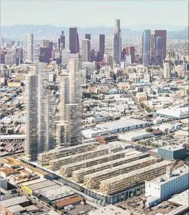  ??  ?? THE 6AM developmen­t would cover 14.5 acres mostly with low-rise buildings, but with two towers — they’d be the first in the Arts District — along Alameda Street.