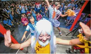  ?? — AFP ?? Colourful show: Dancers performing during Bilibili Macro Link 2017, an annual convention of animation, comic and game in Shanghai.