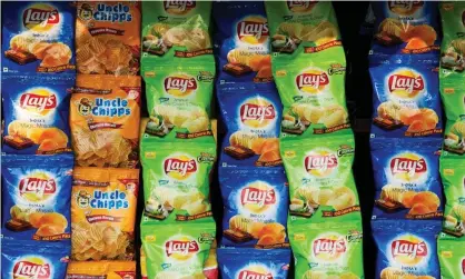  ??  ?? PepsiCo’s Lay’s crisps. The role of foreign companies in producing and selling food in India is a hotly contested issue. Photograph: Tim Gainey/Alamy