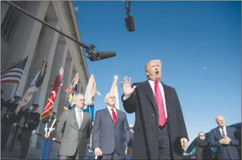  ?? AP PHOTO ?? President Donald Trump, joined by Defense Secretary Jim Mattis, left, Vice President Mike Pence, second from left, and White House Chief of Staff John Kelly, right, speaks to the media as he arrives at the Pentagon.
