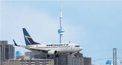  ?? RENÉ JOHNSTON TORONTO STAR FILE PHOTO ?? WestJet says it won’t follow the lead of Indonesia’s flag carrier, which cancelled its multibilli­on-dollar order for 49 Max 8 jets.