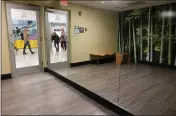  ?? ?? People walk passed the Yoga Room on their way to and from their flights during the day on Jan. 29 at Miami Internatio­nal Airport.