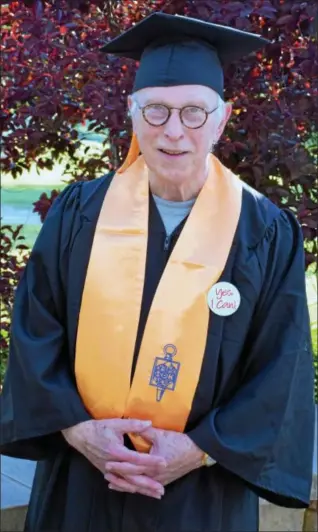  ?? DEBBY HIGH — FOR DIGITAL FIRST MEDIA ?? John Sprouse, 72, of Lansdale, poses for a photo on his graduation night at Montgomery County Community College’s main campus in Whitpain.