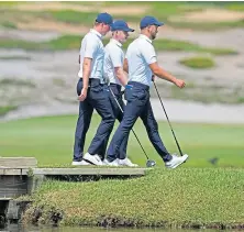  ??  ?? Mark Power, left, Angus Flanagan and Matty Lamb, right, of GB and Ireland, during practice yesterday.