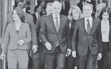  ?? AFP ?? German foreign minister Annalena Baerbock (left), Nato deputy secretary-general Mircea Geoana (centre) and US secretary of state Antony Blinken (second right) at an informal meeting of Nato foreign ministers to discuss Ukraine conflict in Berlin, on Sunday.