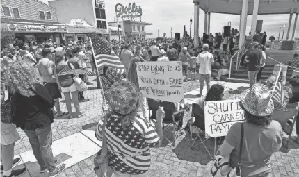  ?? CHUCK SNYDER/SPECIAL TO USA TODAY NETWORK ?? A Rally to Re-Open Rehoboth Beach’s Boardwalk and Beach was held on May 16 at the Bandstand in downtown Rehoboth Beach, Del., with about 200 protesters in attendance.