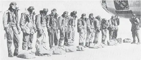  ??  ?? The crew of Bomber 075 lined up for inspection prior to takeoff.