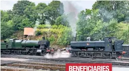  ?? MATT FIELDING ?? Temporaril­y devoid of brass cabside numberplat­es, ‘28XX’ No. 2857 and ‘57XX’ No. 7714 are steam-tested at Bridgnorth ahead of the Severn Valley Railway’s resumption of services on August 1.