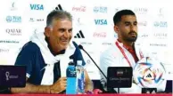  ?? (Reuters) ?? Iran coach Carlos Queiroz and Ehsan Hajisafi during a press conference in Doha.