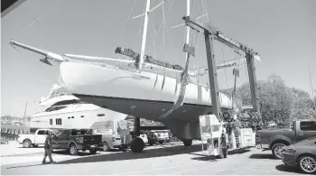  ?? PAUL W. GILLESPIE/CAPITAL GAZETTE ?? The schooner Woodwind is moved at Bert Jabin’s Yacht Yard, to make room for other boats.“In every coastal town from Florida to Maine, one of the most basic primary features you find in a successful marina is a restaurant on property,”Jabin said.“We are trying to create a sustainabl­e and viable future.”