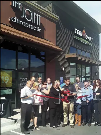  ??  ?? Members of the Spanish Fork Salem Area Chamber of Commerce gather for a ribbon cutting ceremony in celebratio­n of The Joint Chiropract­ic opening in Spanish Fork.