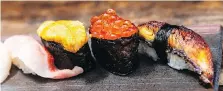  ??  ?? Golden eye snapper, left, uni, salmon roe, unagi (freshwater eel) at Houston’s Kata Robata, which is praised for its high-end sushi.