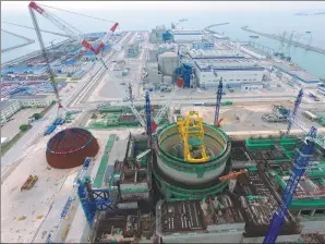  ?? JIANG KEHONG / XINHUA ?? Constructi­on of a third-generation reactor, using technology known as Hualong One, starts in Fuqing, East China’s Fujian province.