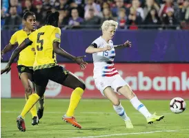  ?? ANDY JACOBSOHN/THE ASSOCIATED PRESS ?? American star Megan Rapinoe, right, believes FIFA doesn’t “truly care” about women’s soccer in the way it does with the men’s game.