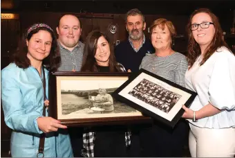  ?? Photo by Michelle Cooper Galvin ?? Aisling Curtayne and Robyn Fleming granddaugh­ters of the late James Coffey (left) presenting old photograph­s and memorabili­a which were donated to the Laune Rangers Club Aiden Clifford, Declan Falvey, Mary Quirke Chairperso­n and Lisa Brenndan Secretary...