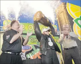  ?? Teresa Long National Hot Rod Assn. ?? “ALL OF US have paid our dues,” said Erica Enders, shown celebratin­g her 2014 pro stock world championsh­ip. “I was given no breaks because of my gender.”