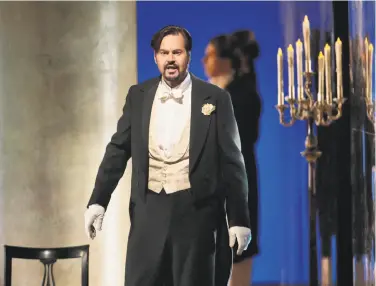  ?? Ken Howard / Metropolit­an Opera ?? Peter Mattei portrays the title character in the Metropolit­an Opera’s production of “Eugene Onegin,” which will be broadcast live to movie theaters worldwide on Saturday.