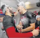  ?? John Bazemore / Associated Press ?? Game 5 winner Jack Flaherty, right, celebrates with Daniel Ponce de Leon after the Cardinals’ win.