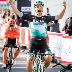  ??  ?? Pascal Ackermann of Germany celebrates after winning Stage 1 of the UAE Tour in Dubai on Sunday. Today’s Stage 2 is a hilly 168km ride from Hatta Heritage Village to Hatta Dam.