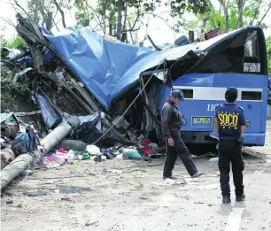  ?? AP Photo ?? The bus that crashed in the town of Tanay was carrying dozens of students on a camping trip.