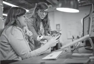  ??  ?? Leah Busque (right), founder of TaskRabbit, works with marketing manager Lauren Sherman at company offices in San Francisco. TaskRabbit is an on-demand service for handling quick jobs — such as assembling Ikea furniture, packing boxes and wrapping gifts.