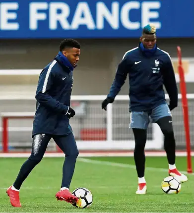  ?? — Reuters ?? Practice makes perfect: France’s Paul Pogba (right) and Thomas Lemar in action during a training session in Clairefont­aine on Monday.