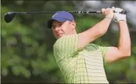  ?? Ezra Shaw / Getty Images ?? Rory Mcilroy of Northern Ireland plays his shot from the 17th tee during the first round of the PGA Championsh­ip at Southern Hills Country Club on in Tulsa, Oklahoma.