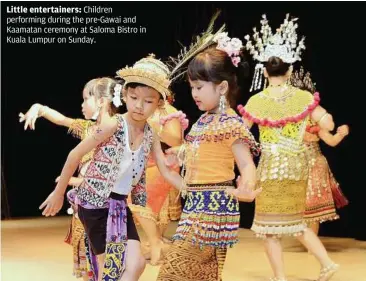  ??  ?? Little entertaine­rs: Children performing during the pre-gawai and Kaamatan ceremony at Saloma Bistro in Kuala Lumpur on Sunday.