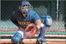  ?? MORRY GASH/AP PHOTO ?? William Contreras of the Milwaukee Brewers catches during a spring training workout on Feb. 16 in Phoenix.