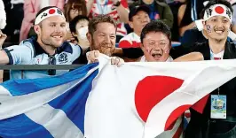  ?? AP ?? Thriller: Scotland and Japan fans get behind their teams