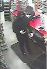  ?? Submitted photo ?? ■ A photo taken from a security video shows a male suspect who reportedly robbed the E-Z Mart, 505 Summer St., shortly after 4 a.m. Tuesday and is believed to have committed two other robberies since. Photo courtesy of the Hot Springs Police Department.