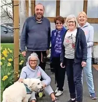  ?? ?? Dr David Scott, Flossy his dog and some volunteers at the Ramsbottom Pantry