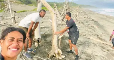  ?? ?? Ranger team building a driftwood tipi along the dune beach front.