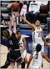  ?? AP/JESSICA HILL ?? Cincinnati’s Sam Rodgers (11) shoots as Connecticu­t’s Azura Stevens (23) defends during Connecticu­t’s 75-21 victory over Cincinnati. Connecticu­t will play South Florida in the championsh­ip game of the American Athletic Conference Tournament.