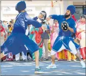  ??  ?? RIGHT: Traditiona­l Indian martial arts were demonstrat­ed as part of the Sikh Parade.