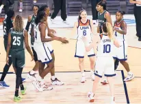  ?? CHASE STEVENS/AP ?? U.S. guards Sue Bird (6) and Jewell Loyd (4) gather with teammates during a break while playing Nigeria in a pre-olympic exhibition basketball game in Las Vegas on Sunday.