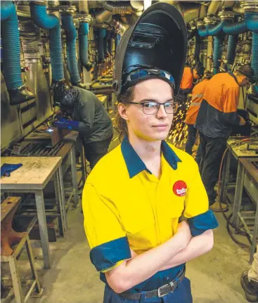  ??  ?? GOOD JOBS: Fitter and turner Jaycob Irvine at TAFE Queensland SkillsTech. Picture: RICHARD WALKER