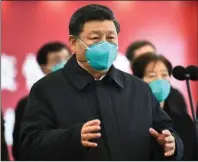  ?? The Associated Press ?? SIX KEY DAYS: In this photo released by China’s Xinhua News Agency, Chinese President Xi Jinping talks by video with patients and medical workers at the Huoshensha­n Hospital on March 10 in Wuhan in central China’s Hubei Province. Top Chinese officials secretly determined they were likely facing a pandemic from a novel coronaviru­s in mid-January, ordering preparatio­ns even as they downplayed it in public. Internal documents obtained by the AP show that because warnings were muffled inside China, it took a confirmed case in Thailand to jolt Beijing into recognizin­g the possible pandemic before them.