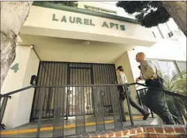 ?? Genaro Molina Los Angeles Times ?? SHERIFF’S DEPUTIES approach the West Hollywood complex where Democratic donor Ed Buck was arrested on suspicion of operating a drug house.