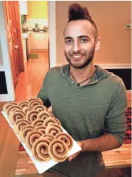  ?? WOOD, MILWAUKEE JOURNAL SENTINEL ?? Mike Behringer, 2018 Holiday Cookie Contest winner, displays his Cranberry Chai Swirls.