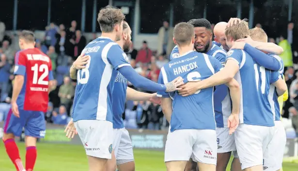  ?? Peter Hilton Photograph­y ?? Macclesfie­ld celebrate Ryan Lloyd’s early goal against Aldershot at the Moss Rose on Saturday where the Silkmen won 2-0