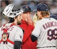  ?? Sarah Stier/Getty Images ?? Pitching coaches such as Cleveland’s Carl Willis are helping their players adjust to the new pitch clock.