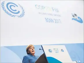  ?? [ Reuters ] ?? Merkel zu Pariser Zielen: „Braunkohle muss wesentlich­en Beitrag leisten.“